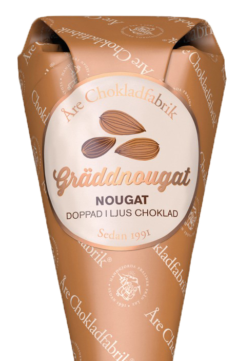 Grddnougat frpackad i en dekorativ strut, frn re Chokladfabrik