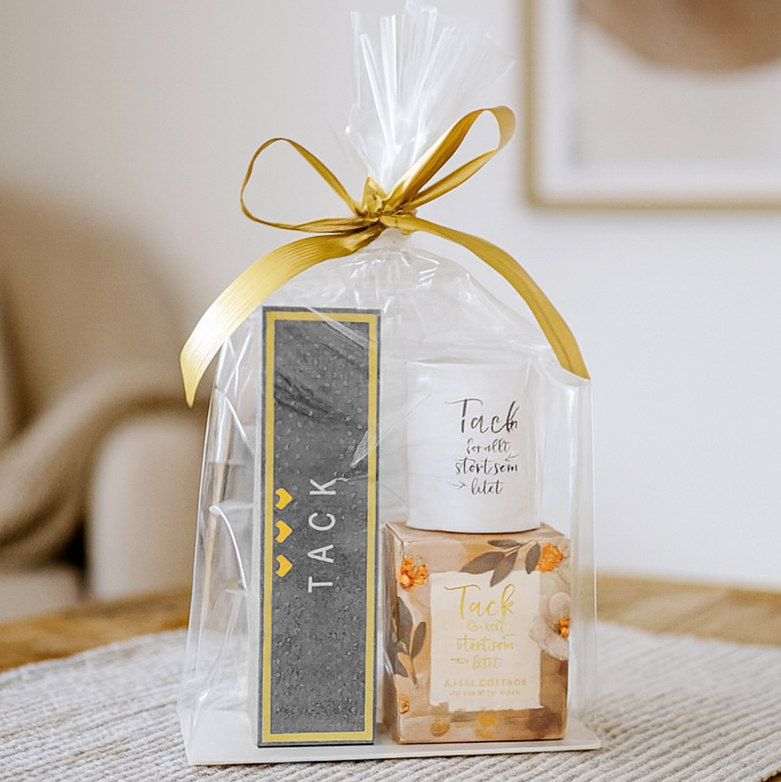 Presentset Tack i cellofan (Chokladpraliner & ljuslykta)