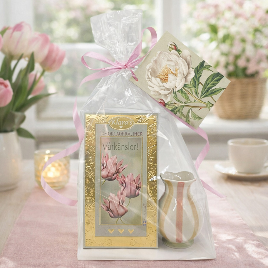 Presentset Vårkänsla i cellofan (Chokladpraliner & ljuslykta)